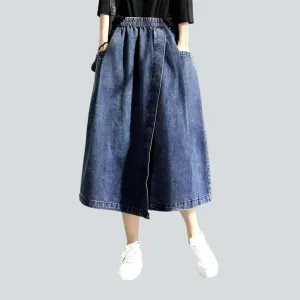 Asymmetric denim skirt with rubber